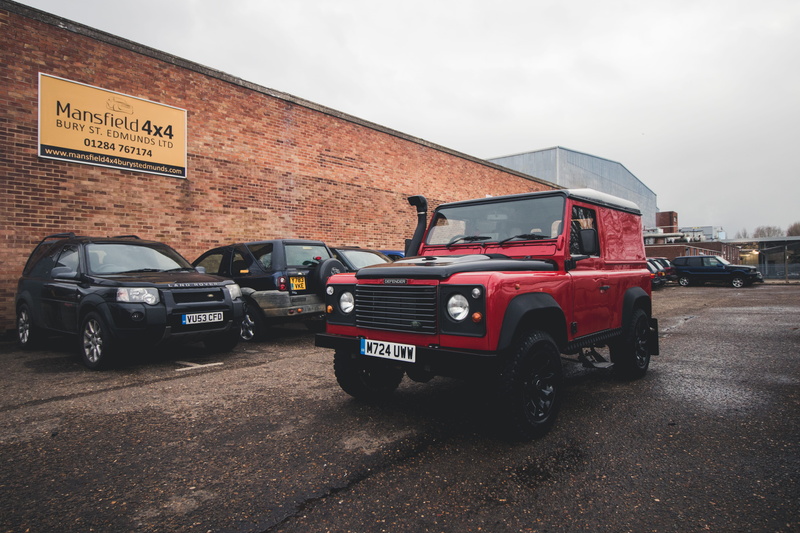 sky, land vehicle, outdoors, defender, truck, offroad, vehicle, land, road, rover, red, day, wheel, 5K, text, communication, city, parking lot, land rover defender