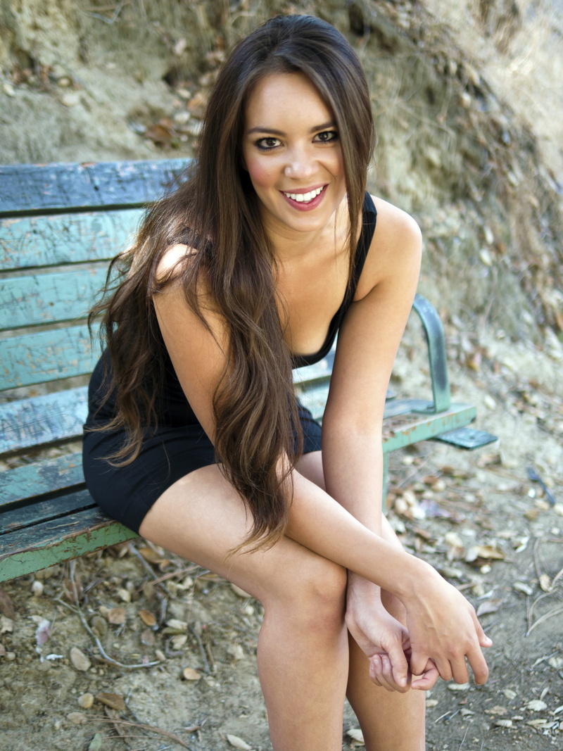 hairstyle, sitting, young women, leisure activity, 4K, black tight dress, hair, teeth, one person, girl, beautiful woman, blue, bench, green, beauty, sleeveless