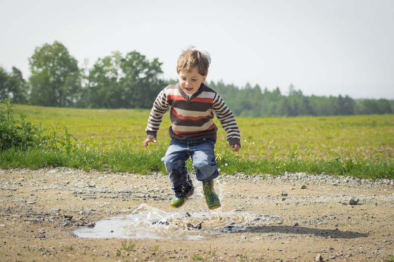 recreation, child, day, plant, leisure, joy, real people, grass, puddle, males, adorable, fun, kid, happiness, nature, summer, innocence, one person, rubber boot