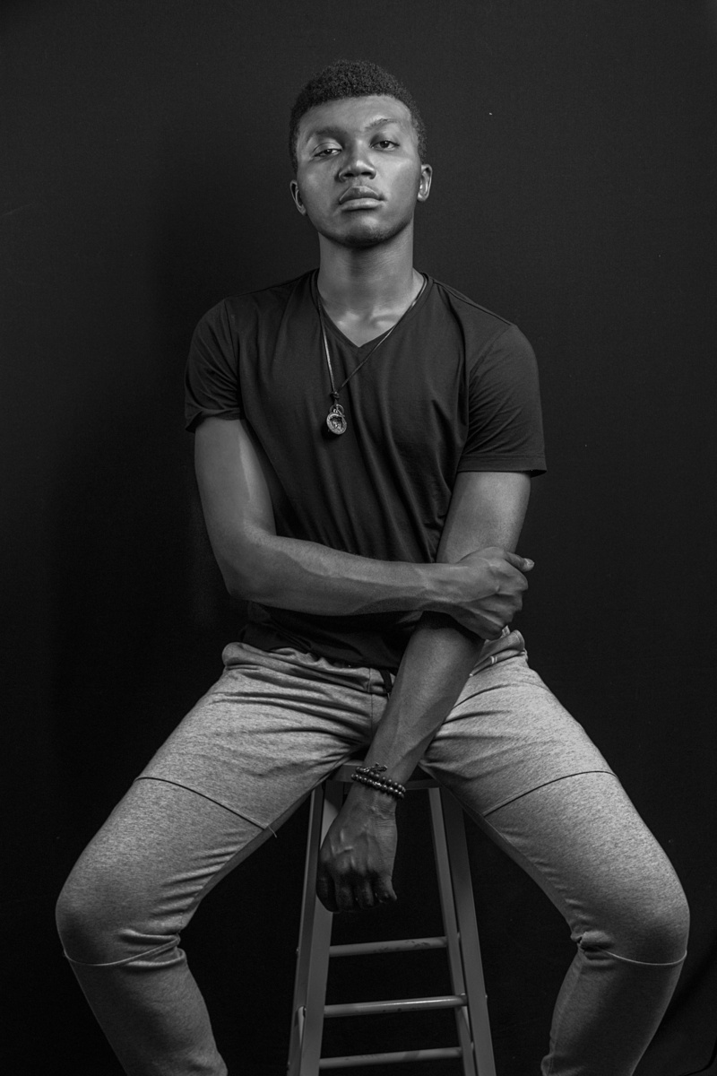 wall - building feature, franck, lifestyles, portrait, black background, cool, young men, three quarter length, young adult, studio shot, real people, handsome