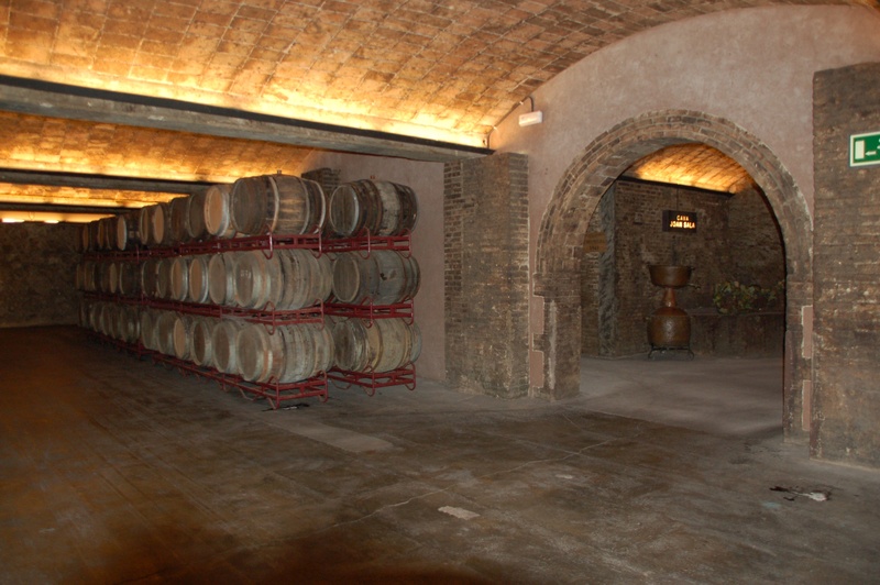 alcohol, spain, indoors, in a row, built structure, no people, ceiling, winemaking, food and drink, architecture, building, wine cask, cellars, wine barrels