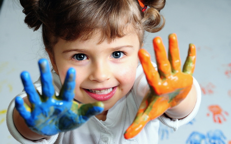 happiness, close-up, hand, little girl, yellow, education, joy, girls, showing, lifestyles, childhood, painting, colors, drawing - Activity, classroom