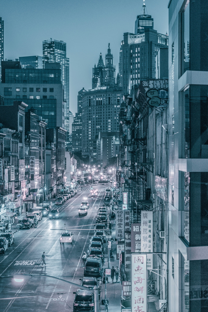 office building exterior, built structure, illuminated, newyork, motion, dark, traffic, high angle view, motor vehicle, graffiti, road, street, architecture