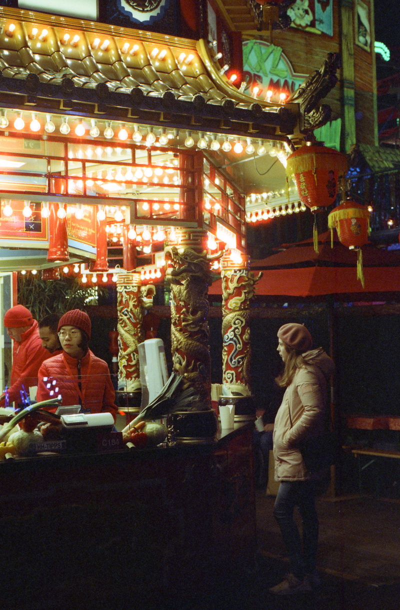 leisure activity, representation, building, amusement park, sitting, lifestyles, women, retail, market, lighting equipment, theme park, carousel, shopping
