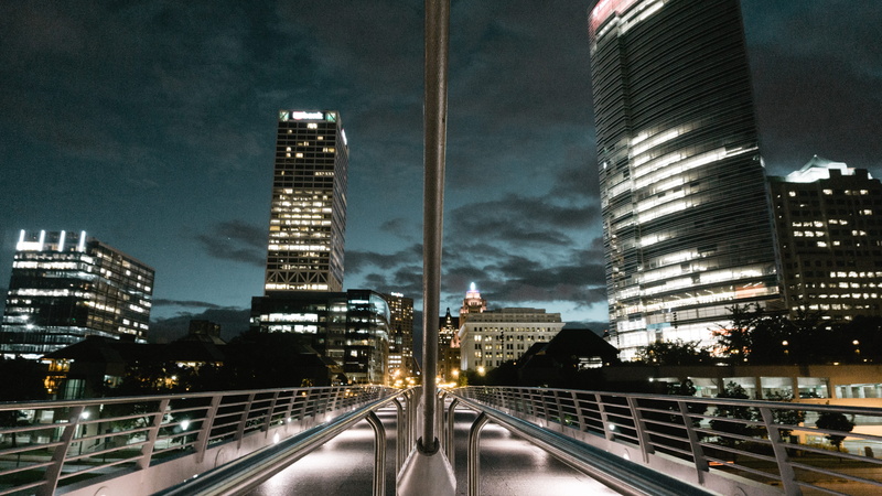 sky, building, architecture, city life, outdoors, transportation, city, nightscape, cityscape, city lights, nature, built structure, glass - material, illuminated