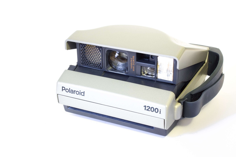 studio shot, recording, single object, fashion, polaroid, photography themes, still life, instant camera, indoors, photographer, camera, design, focus