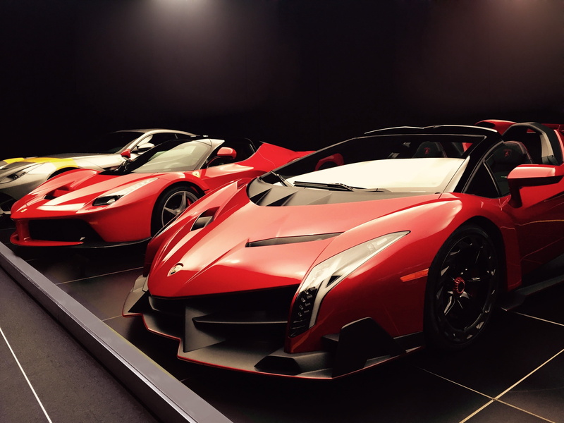 mode of transportation, competition, sports car, land vehicle, car, red, race, ferrari, consumerism, italiana, no people, retail, motor racing track, professional sport