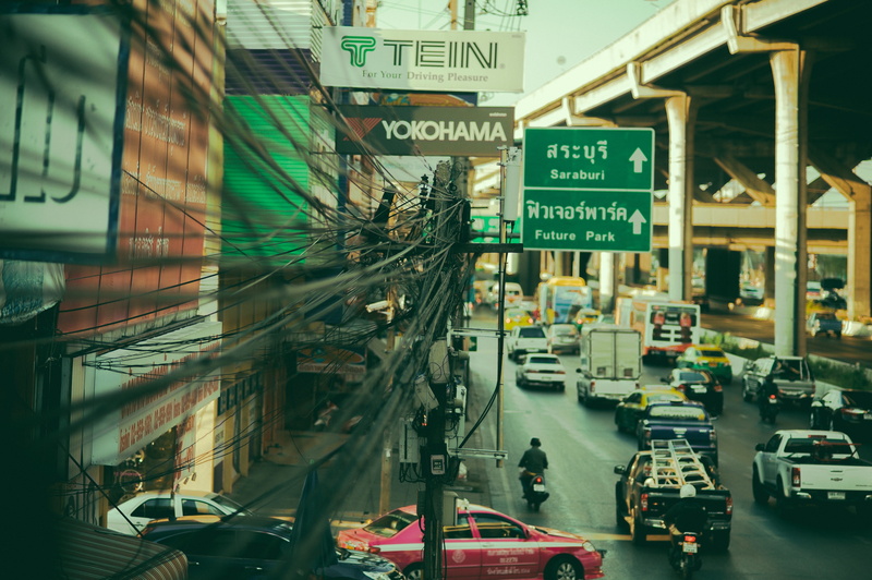 architecture, street, road, highway, script, land vehicle, communication, wires, motor vehicle, sign, bridge, outdoors, bangkok, information, city street