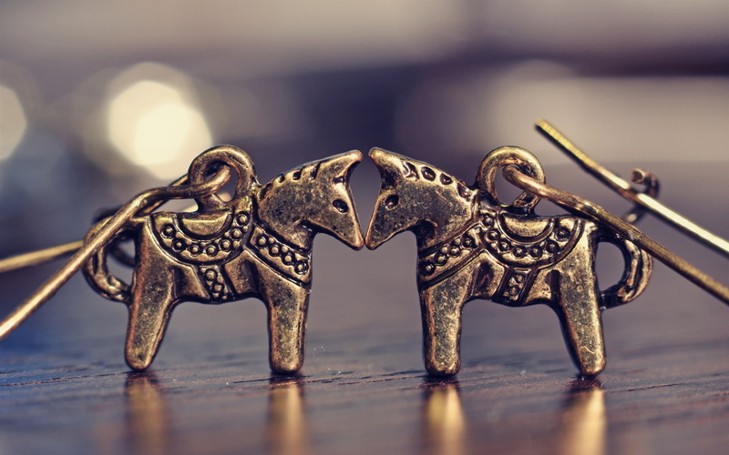 selective focus, focus on foreground, earrings, no people, animal representation, pattern, horse, day, animal, creativity, design, jewelry, colored, two
