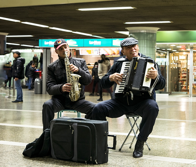 sitting, train - vehicle, travel, real people, accordion, young adult, men, rail transportation, playing, transportation, 4K, public transportation, the musicians
