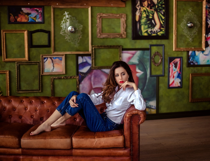 2K, living room, beautiful woman, looking away, shirt, contemplation, home interior, barefoot, red lipstick, jeans, fashion, sofa, frame, domestic room