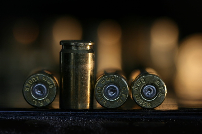 group of objects, day, bullets, cartridge, indoors, colored, bullet, communication, text, weapon, brass, shell, 1080P, antique, metal, lead, focus on foreground