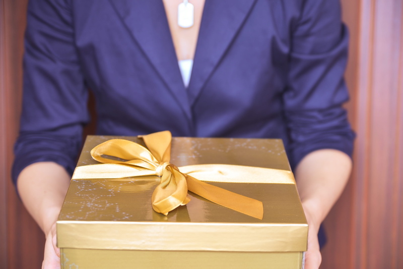 various, ribbon - sewing item, tied bow, gift, present, holding, package, one person, giving, bow, box - container, gift box, ribbon, surprise, gifts, midsection
