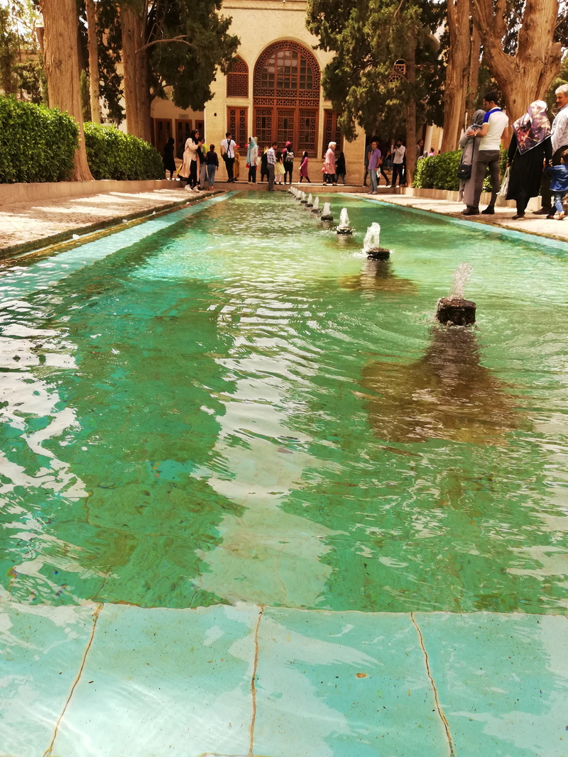 hotel, women, leisure activity, outdoors, large group of people, villa, waterfront, real people, nature, stone, built structure, group of people, building
