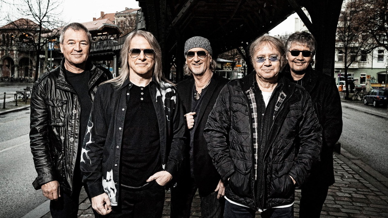 standing, three quarter length, deep purple, males, men, young adult, front view, looking at camera, architecture, young men, mature men, smiling, real people