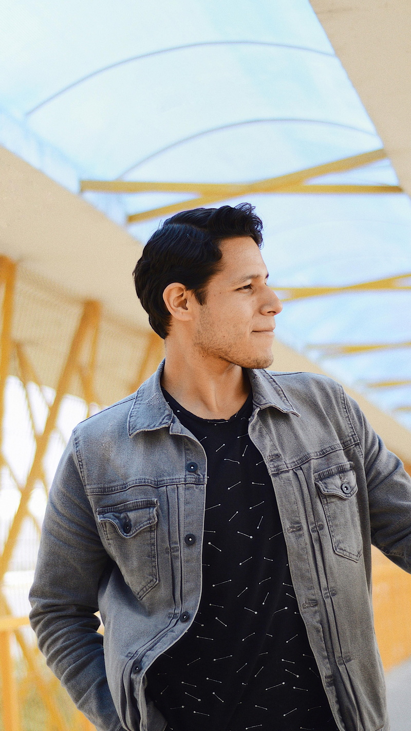 jacket, posing, contemplation, young men, casual clothing, looking away, standing, handsome, one person, focus on foreground, lifestyles, clothing, man