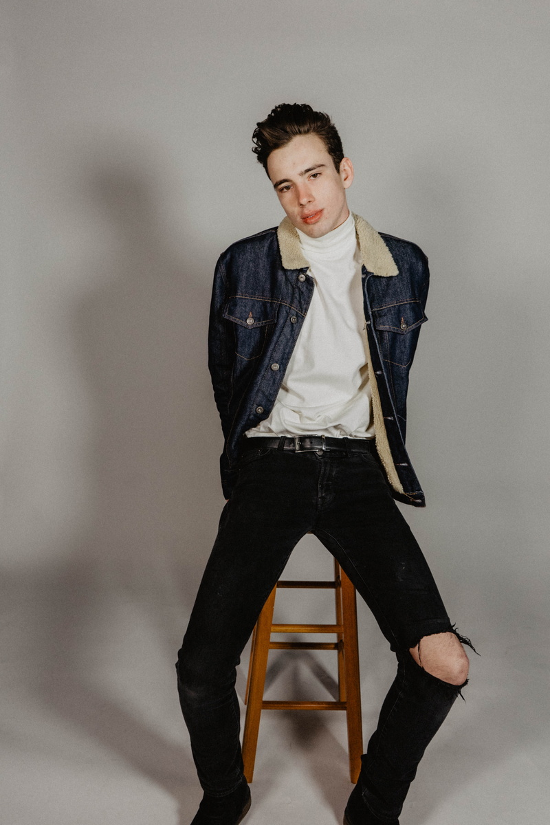 indoors, young men, studio, standing, looking at camera, full length, 5K, front view, turtleneck, one person, jacket, hairstyle, young women, leather