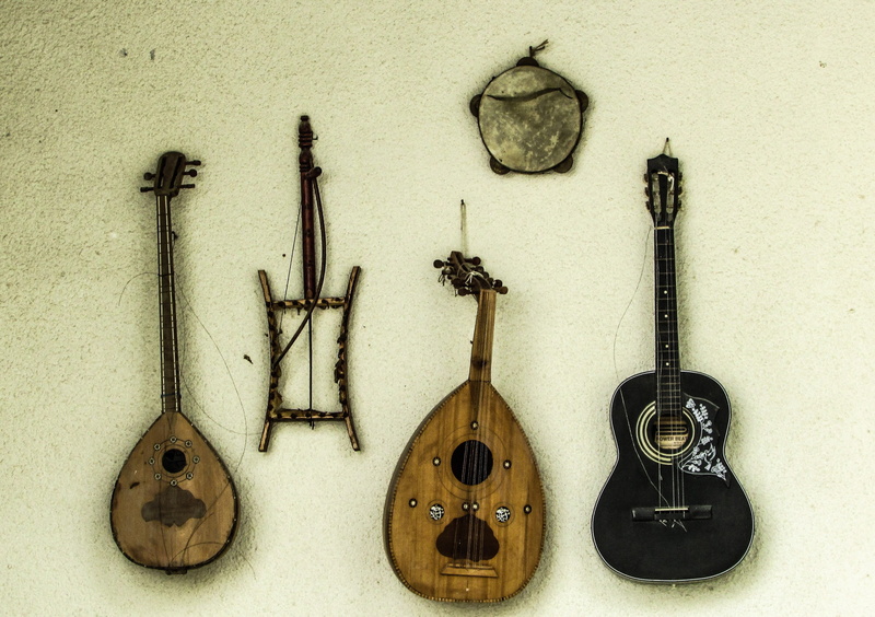 black, tabor, brown, directly above, still life, ukulele, group of objects, arts culture and entertainment, string instrument, choice, two, wall - building feature