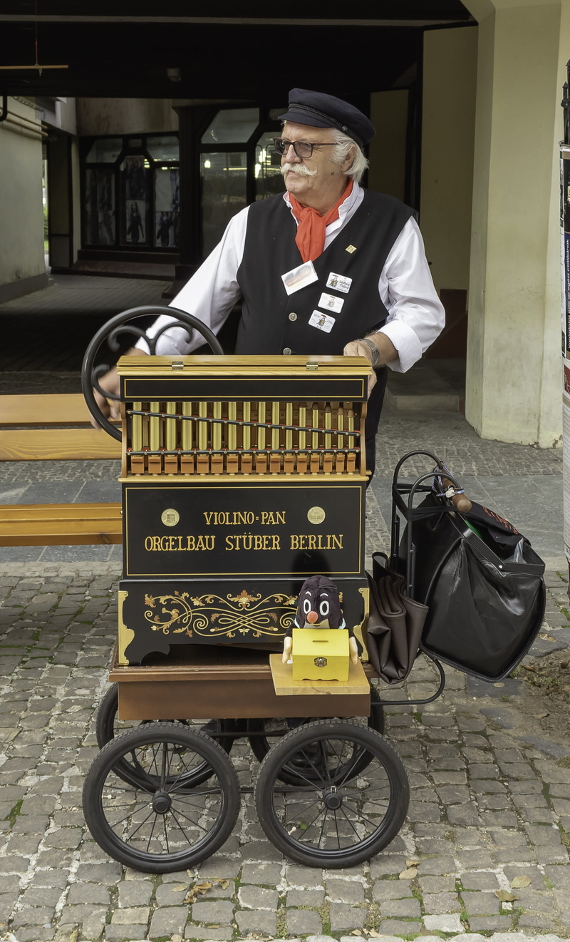 jukebox, lifestyles, real people, clothing, mature men, portrait, adult, tradition, cultural, text, full length, music, carnival, uniform, mode of transportation