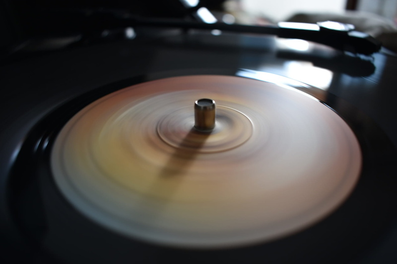 studio shot, audio equipment, no people, classic, retro styled, selective focus, vintage, concentric, disks, record player, 1080P, lp, blurred motion