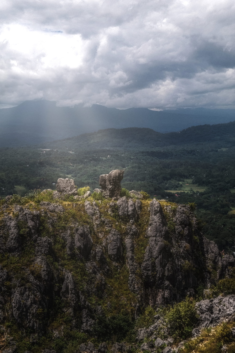 vegetation, cloudy, toraja, rock, mountain, sunrise, beauty in nature, indonesia, tranquility, sky, day, outdoors, no people, brown, cloud - sky, mountain range