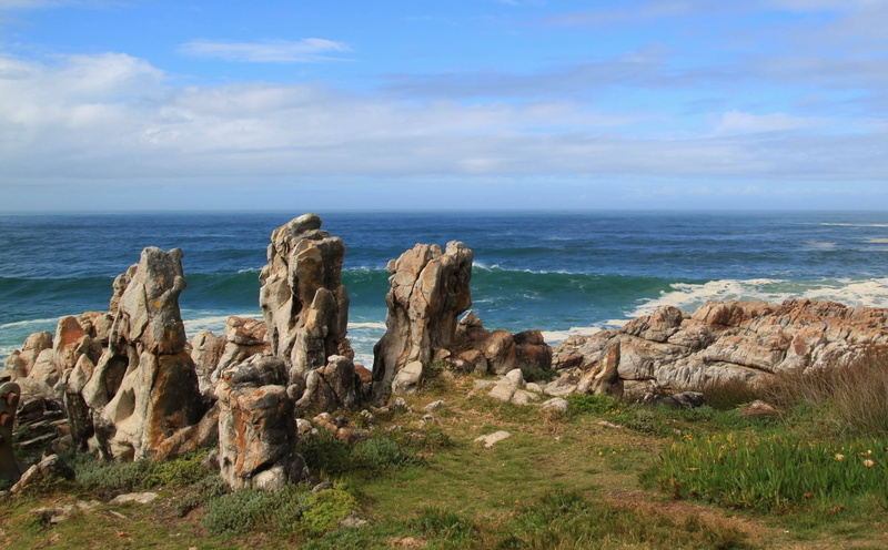 cliff, ocean, formation, landscape, near, rock - object, water, tranquil scene, solid, rock, plant, blue skies, rock formation, beach, skies, beauty in nature