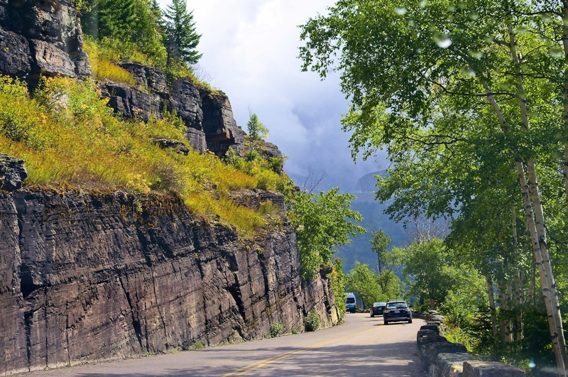 growth, nature, outdoors, rock - object, rock formation, land vehicle, route, transportation, land, car, glacier national park, beauty in nature, scenic