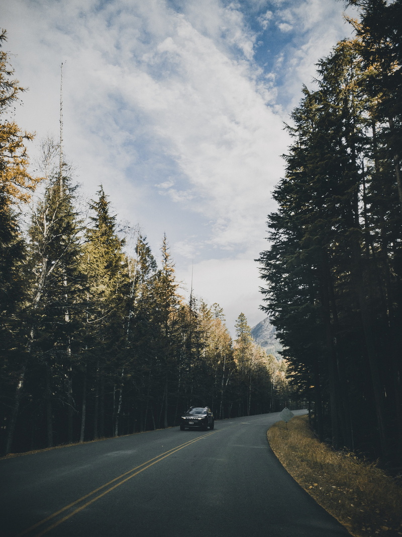 mode of transportation, cloud - sky, highway, motor vehicle, sign, diminishing perspective, gravel, street, 10887 going-to-the-sun rd, no people, walkway