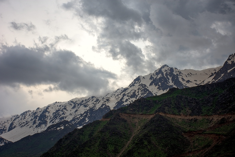 outdoors, tranquil scene, slope, highway, range, ice, countryside, plateau, snow, day, cloud - sky, adventure, mountain range, cold temperature, way, weather