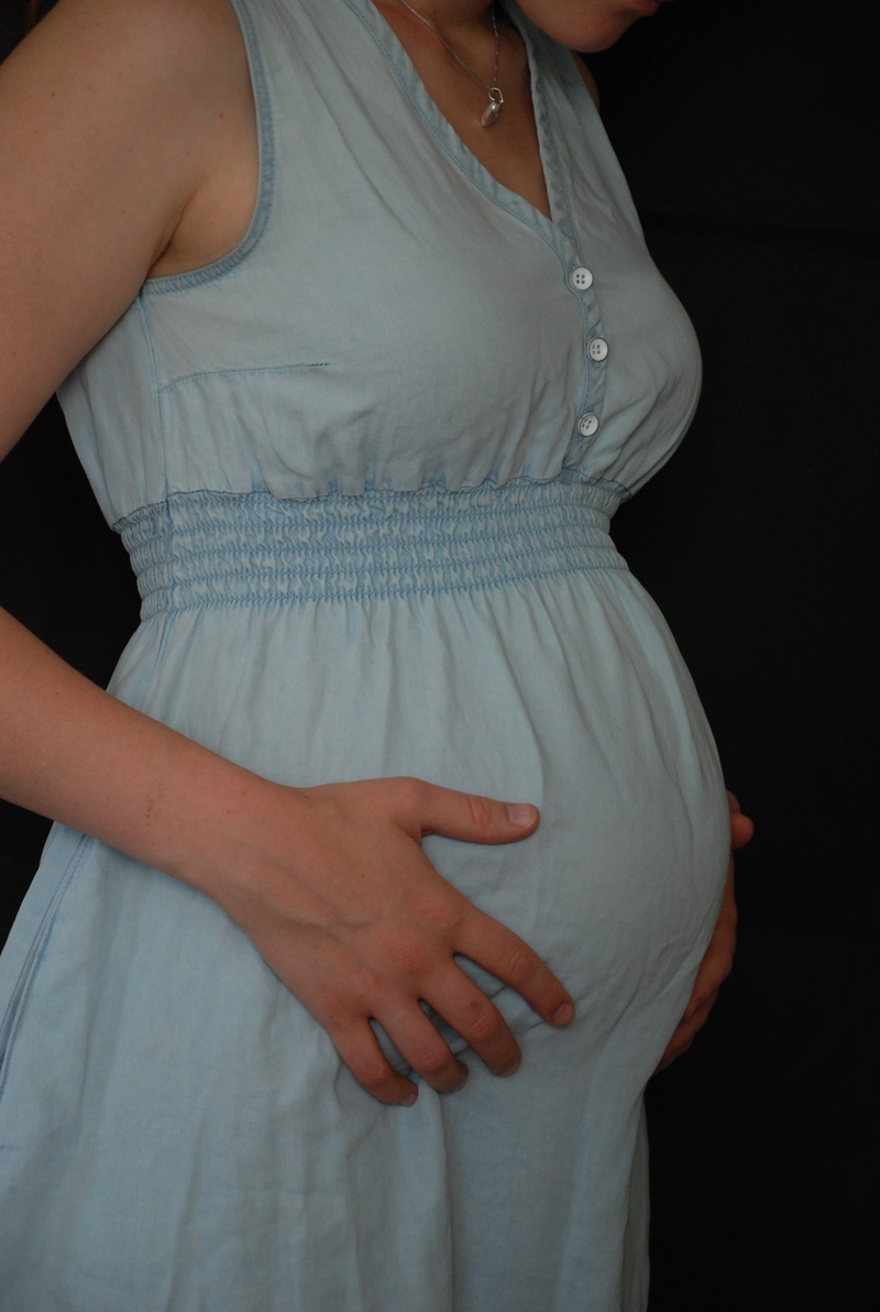 casual clothing, indoors, human fertility, standing, baby, midsection, touching, baby belly, Pregnancy, women, body part, 24, pregnancy week, front view