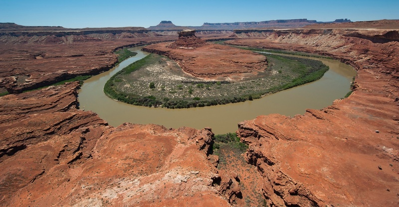 non-urban scene, rock formation, river, sandstone, solid, outdoors, horizon, rock - object, climate, wilderness, rock, no people, desert, travel, water