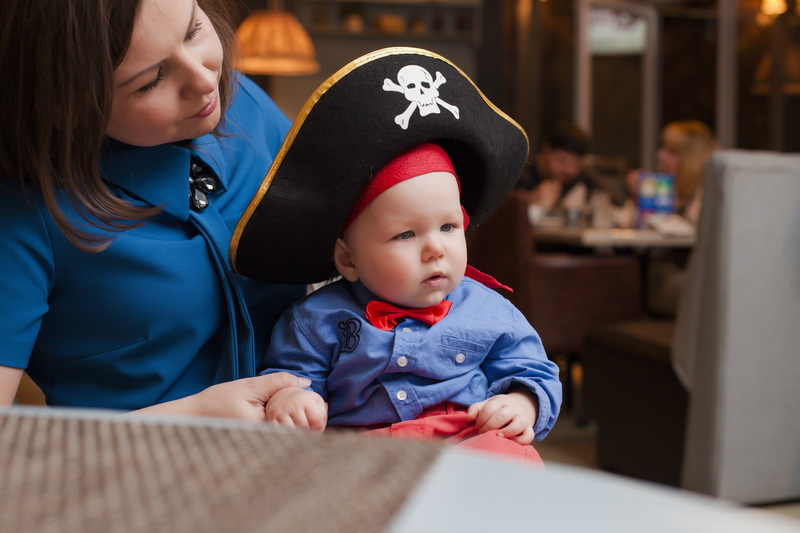 parent, males, baby, costume, men, females, son, 5K, boy, cuddling, kid with mom, indoors, family, sitting, child, two people, woman, young, pirate hat