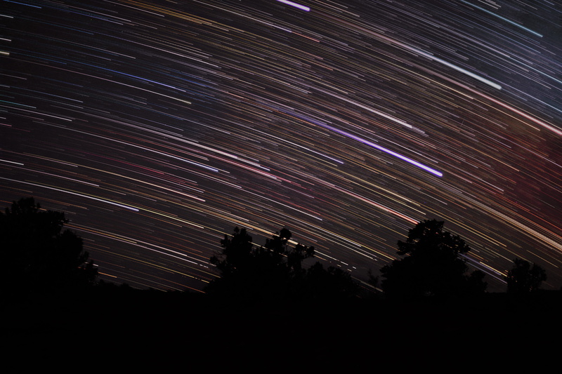 star trails, colors, dark, tranquil scene, outdoors, tree, no people, night sky, star trail, star - space, tranquility, stars, astronomy, nature, beauty in nature
