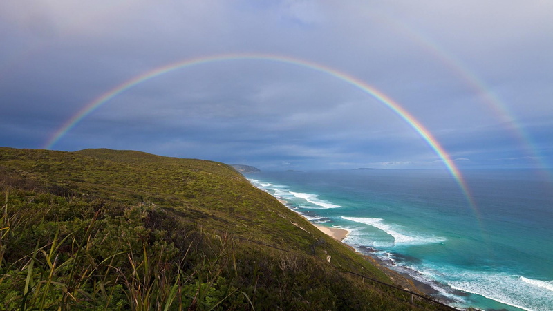 nature, land, scenics - nature, sunlight, shore, water, double rainbow, tranquility, horizon, cloud, headland, atmosphere, wave, sky, beauty in nature