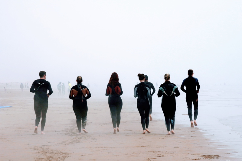 lifestyles, exercising, sea, walking, Run, medium group of people, Movement, men, casual clothing, rain, group, sky, full length, people, leisure activity