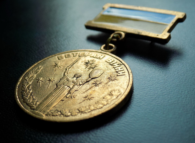 jubilee medal, studio shot, selective focus, indoors, single object, corporate business, close-up, coin, representation, medal, gold colored, gold, military award