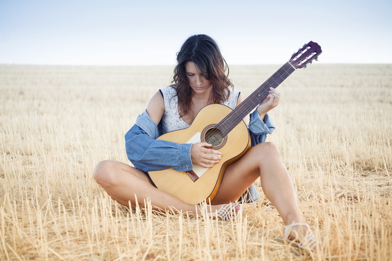 women outdoors, arts culture and entertainment, young adult, musician, 4K, outdoors, hairstyle, sitting, music, string instrument, hair, full length, nature