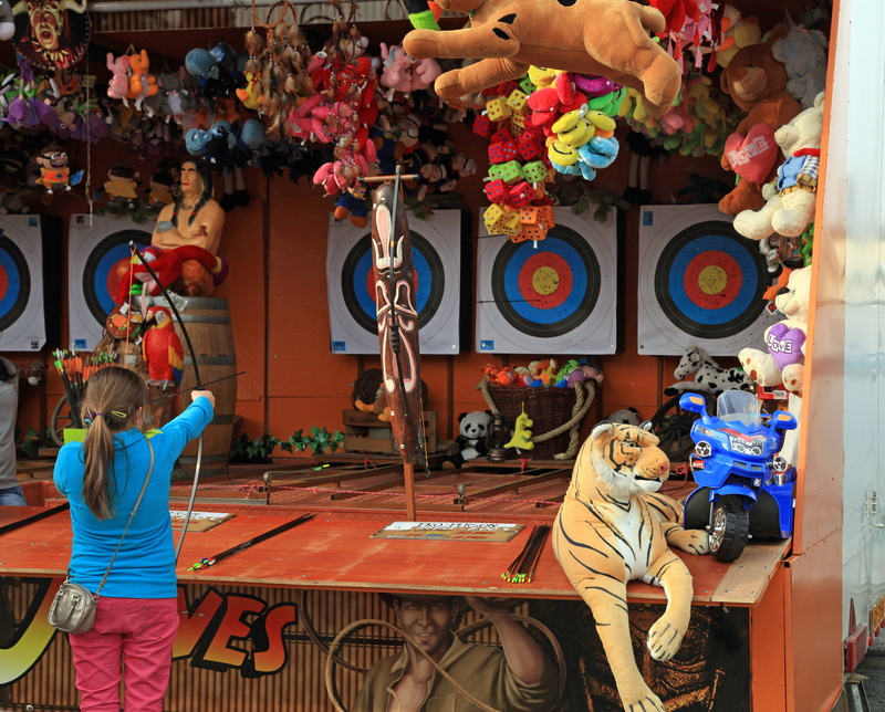 archery, multi colored, adult, indoors, leisure activity, year market, stall, males, arts culture and entertainment, real people, representation, day, group of people