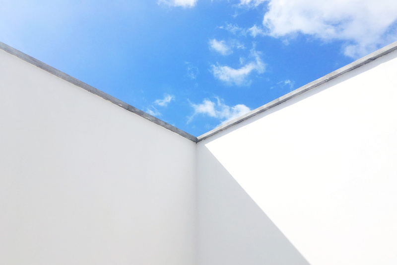skies, blue, window, no people, low angle view, corner, sunset, simplicity, sky, pillar, sunlight, red sky, white color, building exterior, cloud, azure sky