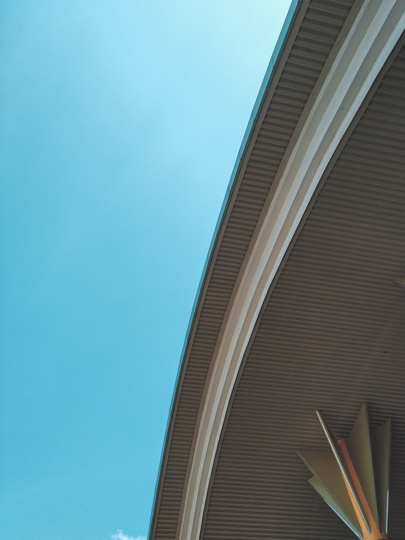 low angle view, copy space, road, office building exterior, sunlight, handrail, building exterior, azure sky, overpass, modern, yogyakarta, column, architecture