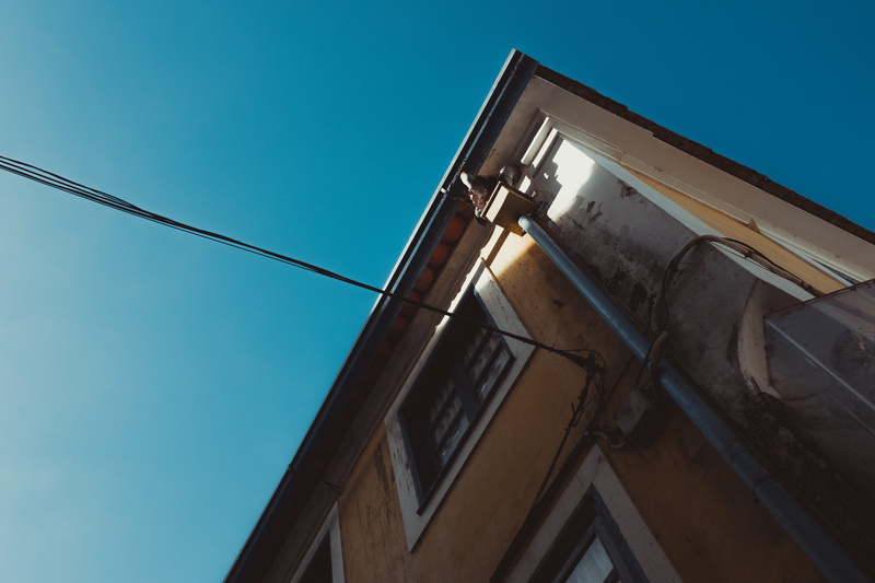lighting equipment, light, banister, day, triangle, industry, sunlight, flare, office building, copy space, sphere, portuguese city, low angle view, cable