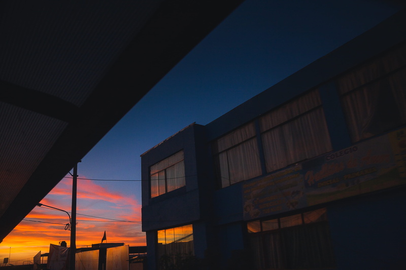 transportation, sun, building exterior, sky, nature, cloud - sky, outdoors, city, scenery, flare, road, sunrise, red sky, silhouette, sunlight, no people