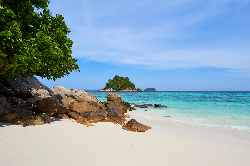 sand, idyllic, no people, koh lipe, tranquil scene, rock, beach, tranquility, tropical, shoreline, land, rocks, cloud - sky, ocean, vacation, water, sky