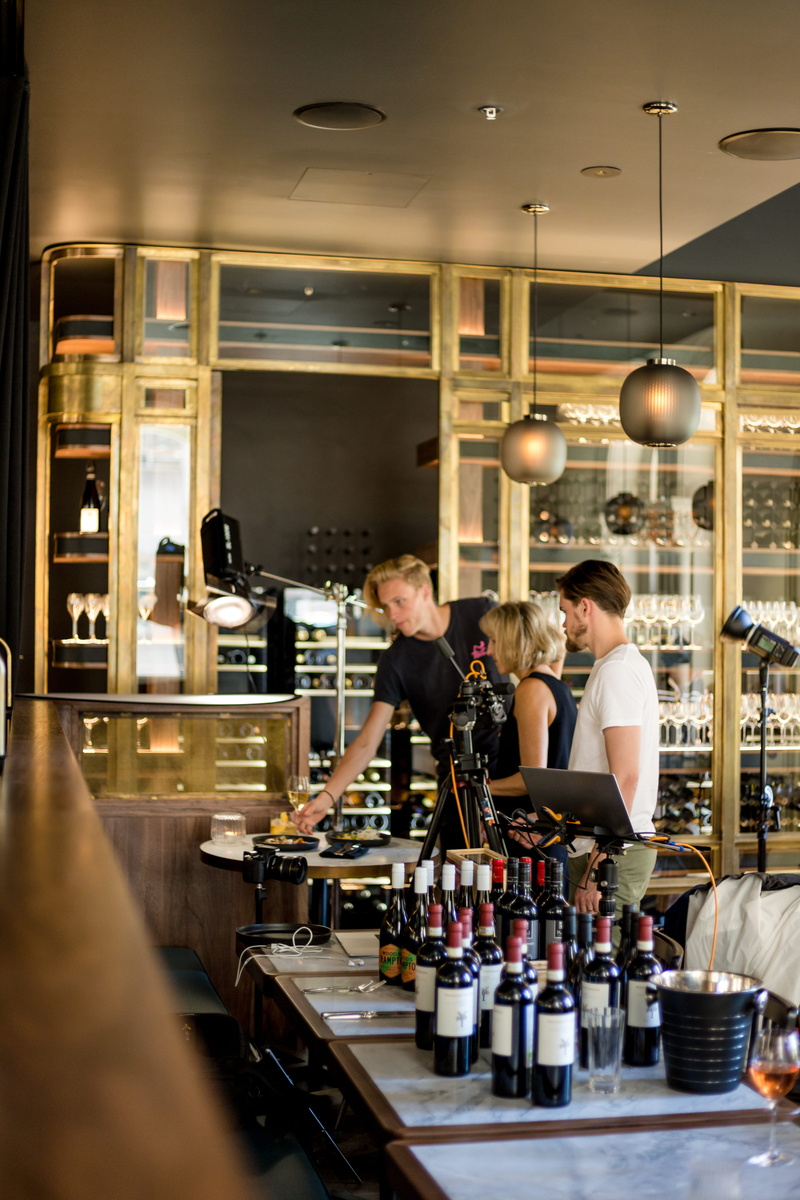 shelf, wine, human, beverage, person, factory, drink, handrail, business, bar - drink establishment, coffee maker, adult, serving food and drinks, pub