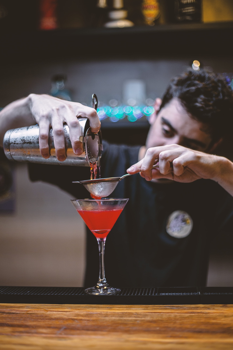 food and drink, women, martini glass, cocktail, bar counter, martini, real people, adult, holding, leisure activity, 5K, focus on foreground, drinking glass