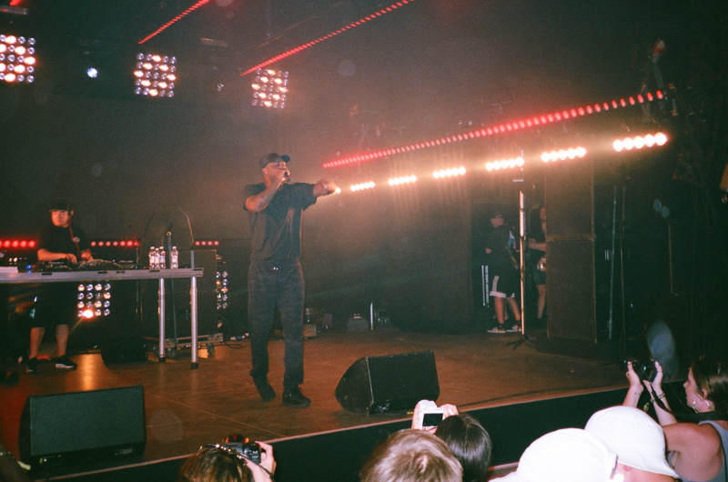 bar - drink establishment, rap, standing, real people, musician, man, lighting equipment, concert, band, 2K, indoors, casual clothing, night, crowd, adult