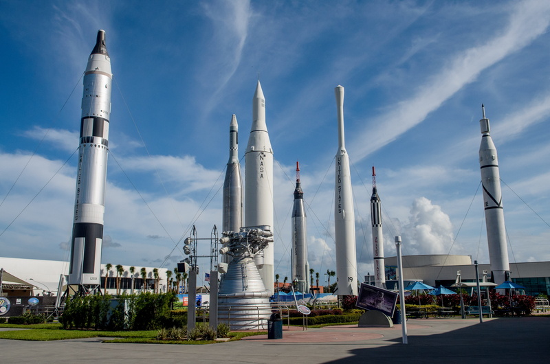built structure, factory, industry, toursim, day, cloud - sky, no people, blue, city, astronauts, nasa, tall - high, transportation, outdoors, kennedy space center visitor complex