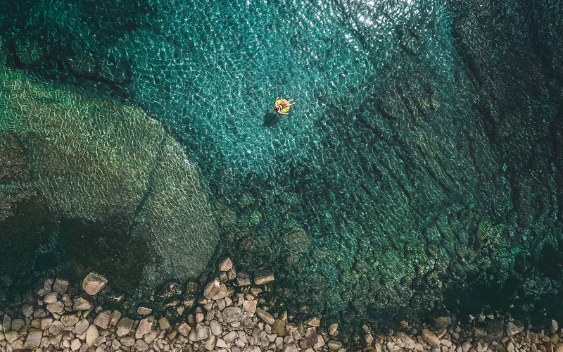 2K, aquatic sport, high angle view, water, sport, sea, turquoise colored, one person, land, adventure, swimming, real people, stock, outdoors, leisure activity