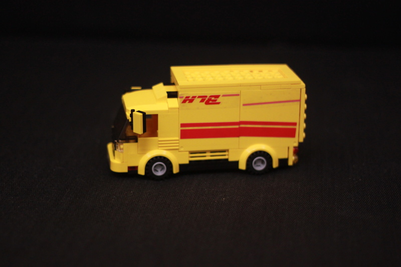 building blocks, express car, shipping, messenger, no people, speed, transportation, black background, small, indoors, motion, delivering, studio shot