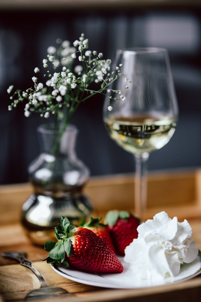 white, cream, table, flower head, focus on foreground, strawberry, still life, white wine, close-up, flower, red, drink, sweet, wineglass, Strawberries